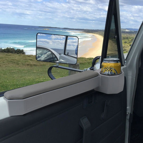 Armrest Cup Holder Magnet Door For Land Cruiser 70 Series shown perfectly holding a can fitted to a 70 series land cruiser on a road trip